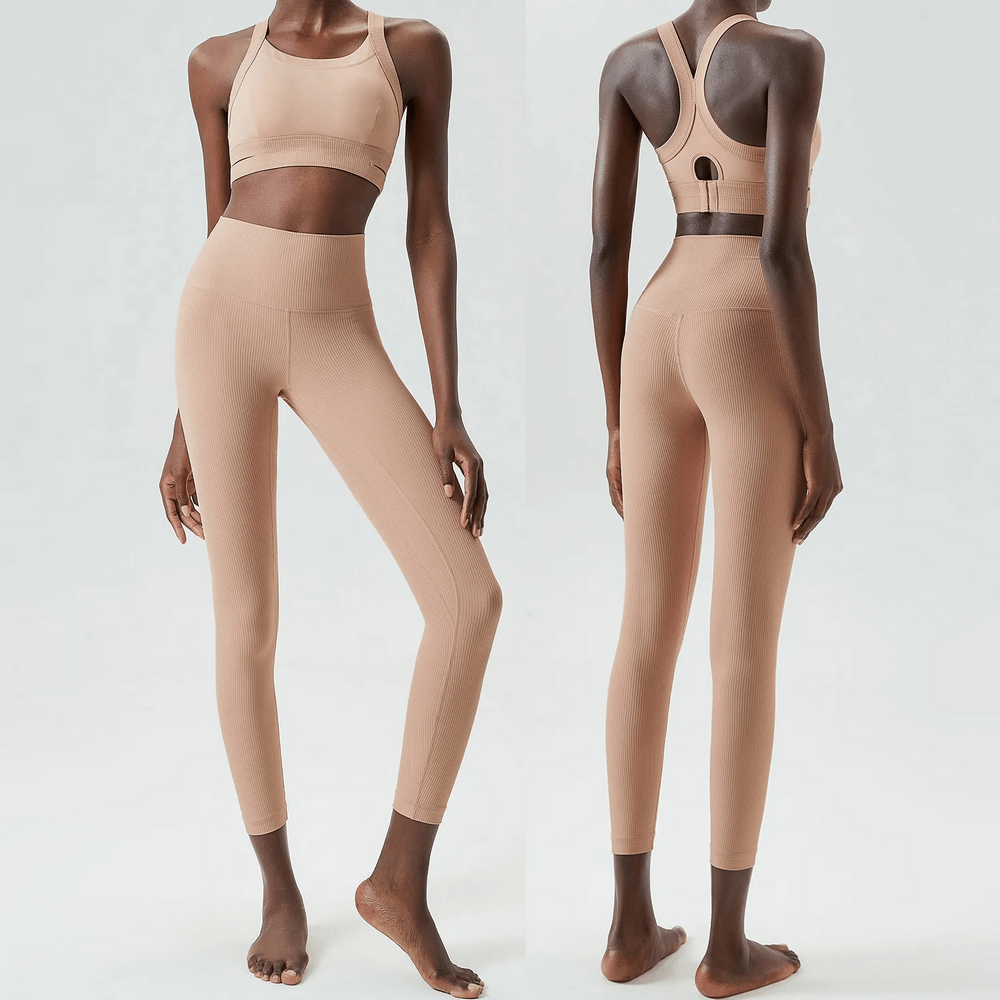 Women's sleek stretch fitness yoga set in beige, featuring high-waisted leggings and a supportive sports bra. Durable and quick-dry fabric.